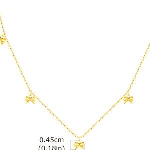 VERY FINE DAINTY 18K GOLD DIPPED BOWS ON A DAINTY CLAVICLE LENGTH CHAIN